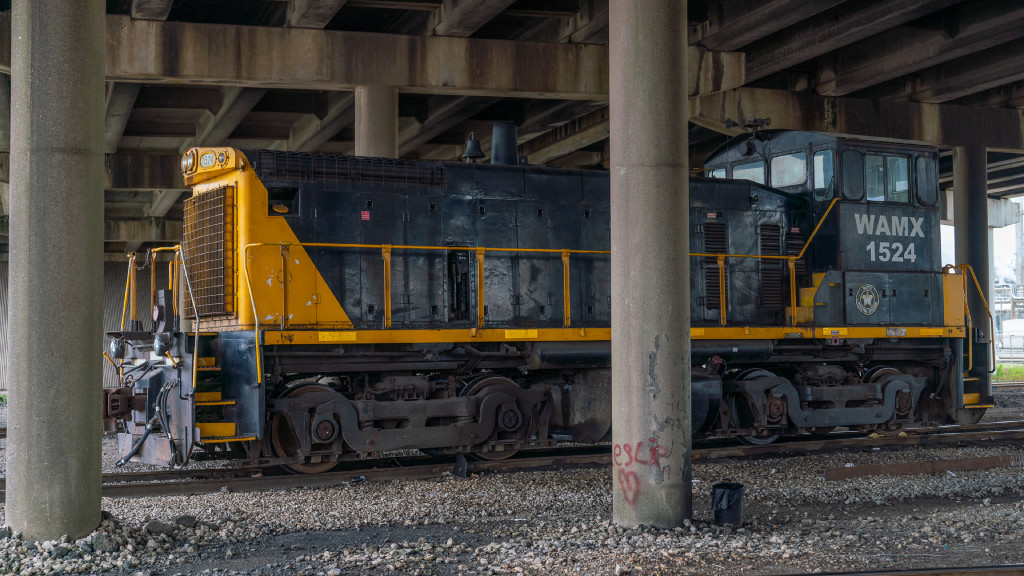 Watco Switcher Sitting Under a Bridge